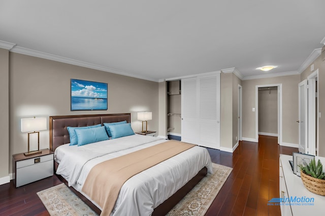 bedroom featuring crown molding, wood-type flooring, baseboards, and a closet