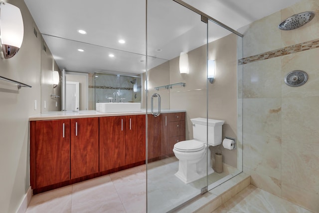 bathroom with a shower stall, double vanity, recessed lighting, toilet, and tile patterned floors