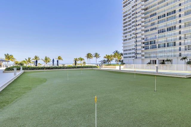 view of property's community with a putting green