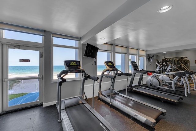 workout area featuring recessed lighting and baseboards