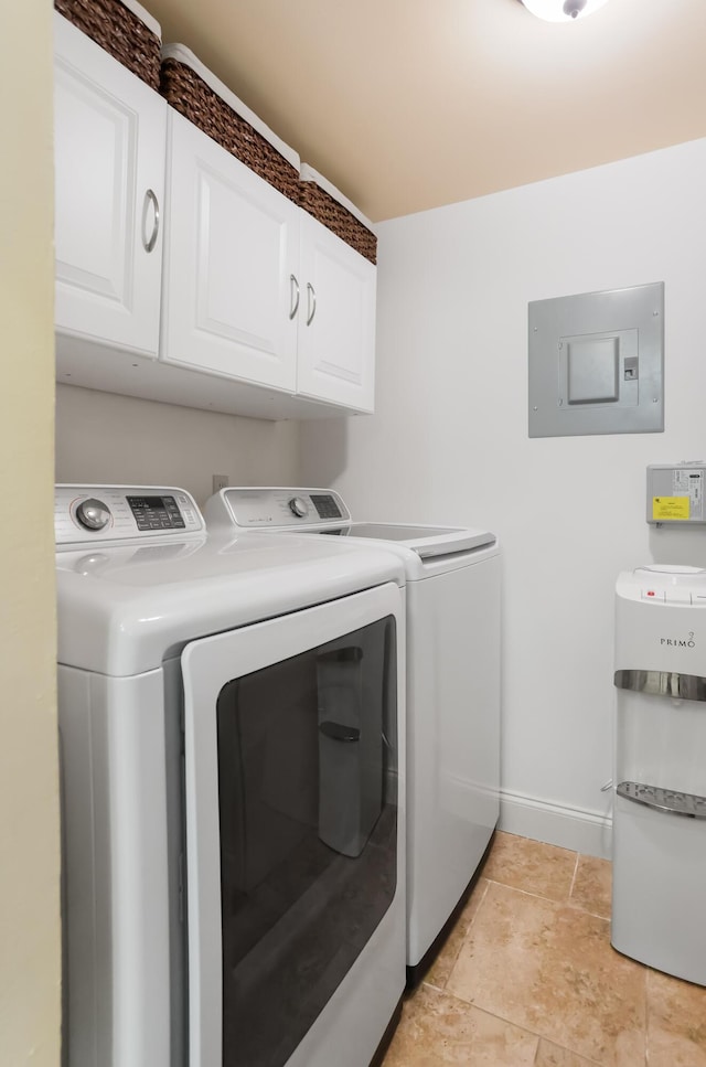 laundry area with baseboards, cabinet space, electric panel, and independent washer and dryer