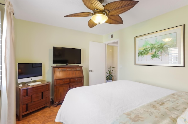 bedroom featuring ceiling fan and light wood-style flooring