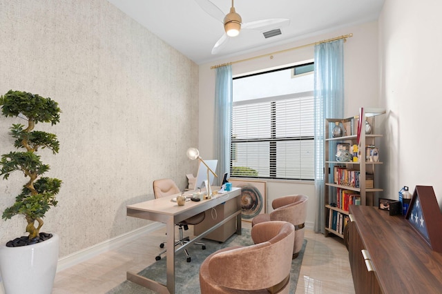 office area featuring visible vents, baseboards, and ceiling fan