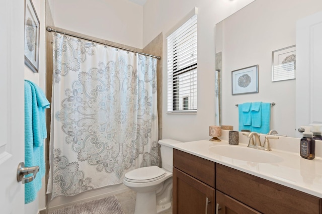 bathroom featuring shower / bathtub combination with curtain, toilet, vanity, and tile patterned floors