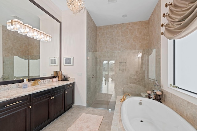 full bathroom featuring a tile shower, visible vents, a notable chandelier, a garden tub, and vanity
