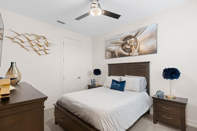 bedroom featuring carpet floors, visible vents, baseboards, and ceiling fan