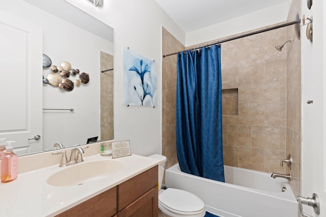 bathroom with shower / tub combo with curtain, vanity, and toilet