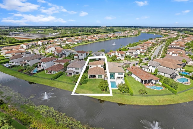 bird's eye view featuring a residential view and a water view