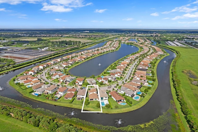 birds eye view of property featuring a residential view and a water view