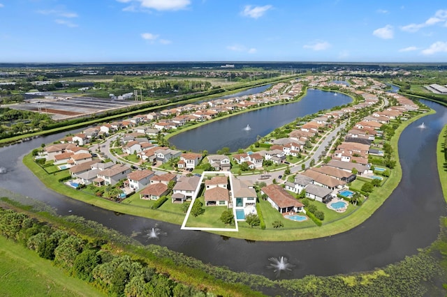 bird's eye view with a residential view and a water view