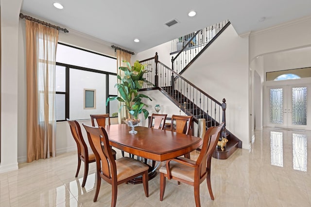 dining area featuring stairs, french doors, baseboards, ornamental molding, and visible vents