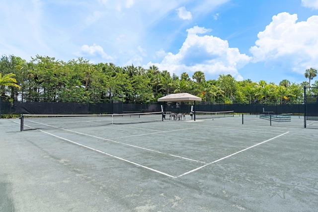 view of sport court with fence
