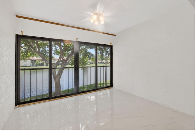 21839 Arriba Real Unit 10-D, Boca Raton, FL 33433 - empty room with a water view, a ceiling fan, a textured wall, and marble tiled flooring