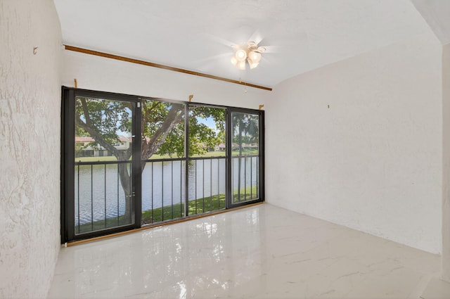 21839 Arriba Real Unit 10-D, Boca Raton, FL 33433 - spare room with a water view, a ceiling fan, and marble tiled flooring