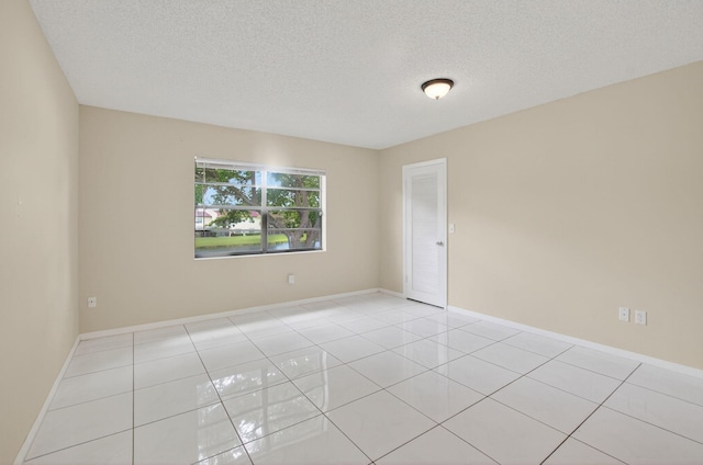 21839 Arriba Real Unit 10-D, Boca Raton, FL 33433 - spare room with light tile patterned flooring and a textured ceiling