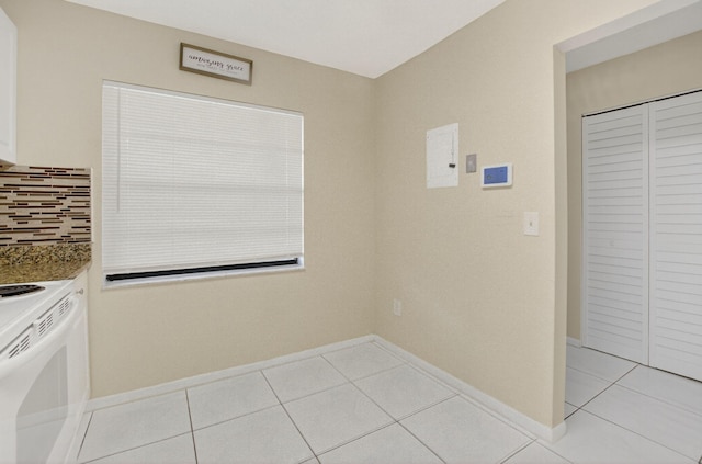 21839 Arriba Real Unit 10-D, Boca Raton, FL 33433 - laundry room with light tile patterned flooring and baseboards