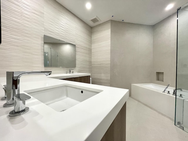 13890 Parc Dr, Palm Beach Gardens, FL 33410 - bathroom featuring a garden tub, vanity, and an enclosed shower