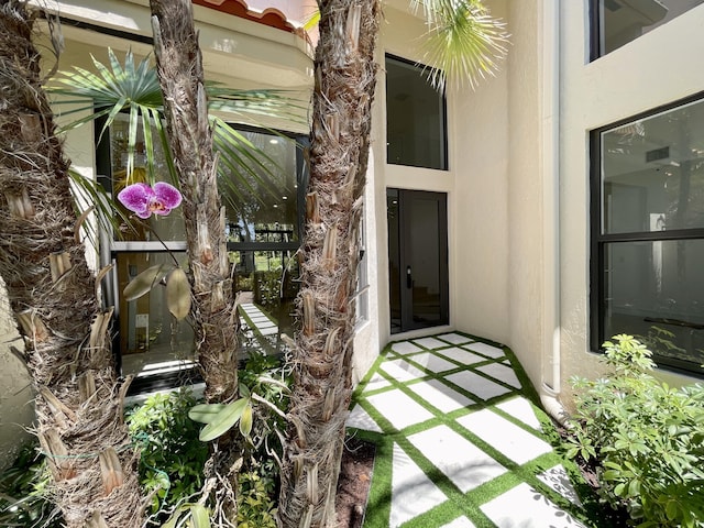 13890 Parc Dr, Palm Beach Gardens, FL 33410 - property entrance featuring stucco siding