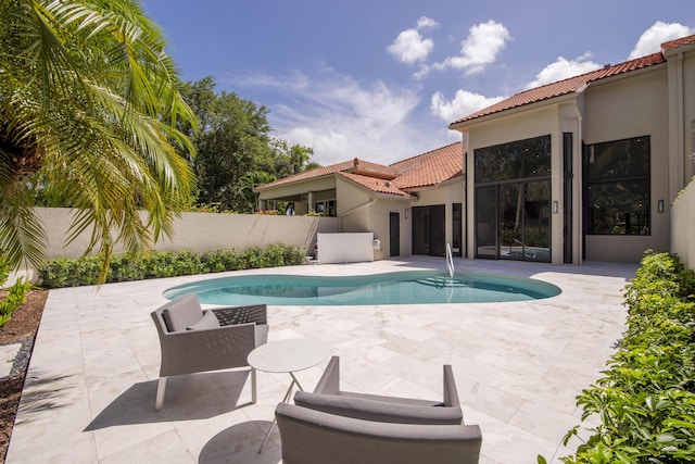 13890 Parc Dr, Palm Beach Gardens, FL 33410 - view of swimming pool featuring a patio and a fenced backyard