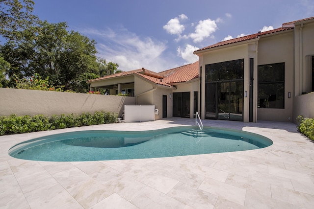 13890 Parc Dr, Palm Beach Gardens, FL 33410 - view of swimming pool with a patio area