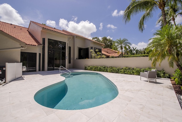 13890 Parc Dr, Palm Beach Gardens, FL 33410 - view of pool with a patio area and a fenced backyard