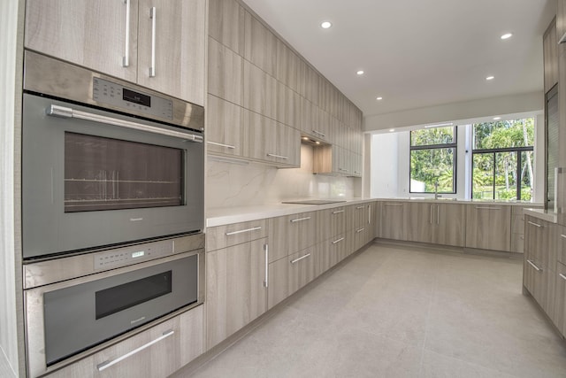 13890 Parc Dr, Palm Beach Gardens, FL 33410 - kitchen with modern cabinets, light brown cabinetry, light countertops, decorative backsplash, and recessed lighting