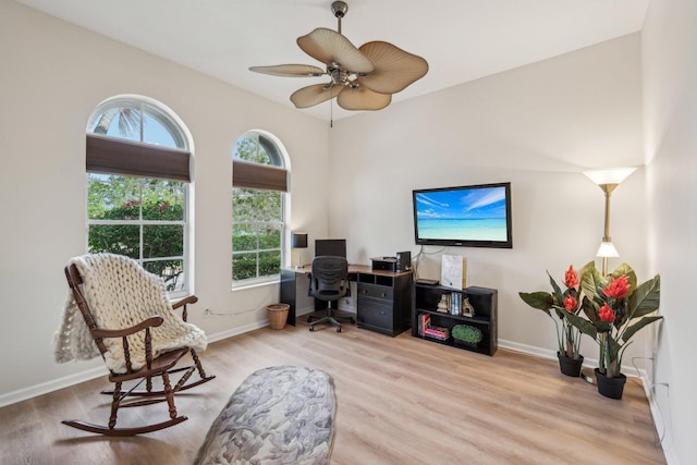 office area with baseboards, wood finished floors, and a healthy amount of sunlight