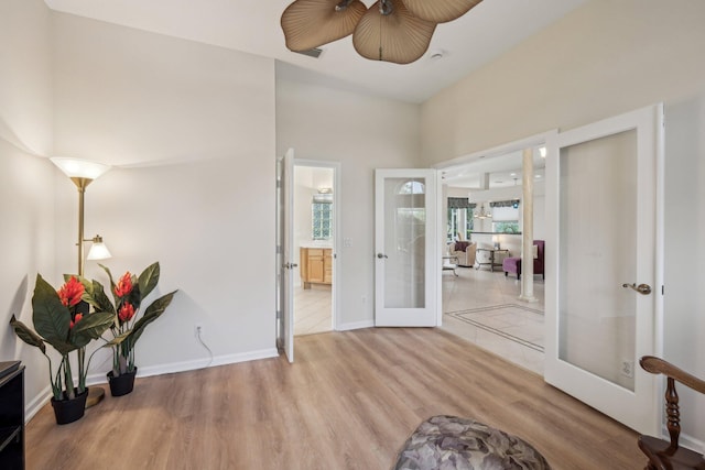 interior space featuring french doors and light wood-style flooring