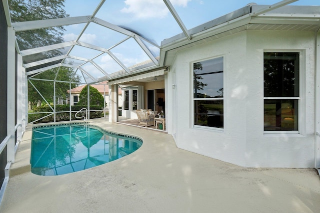 pool with a patio and a lanai