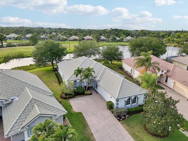 birds eye view of property with a residential view and a water view