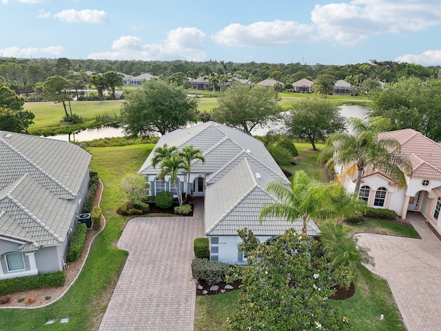 drone / aerial view featuring a residential view and a water view