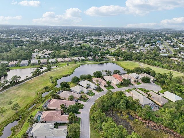 birds eye view of property with a residential view, a water view, and golf course view