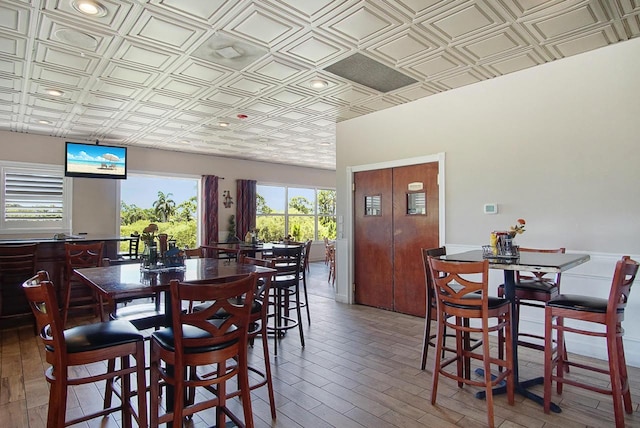 dining space featuring an ornate ceiling and wood finished floors