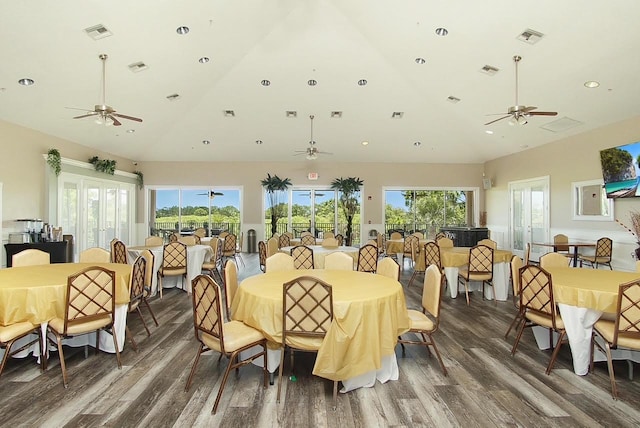 dining area with ceiling fan, wood finished floors, and visible vents