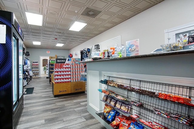 interior space with wood finished floors and an ornate ceiling