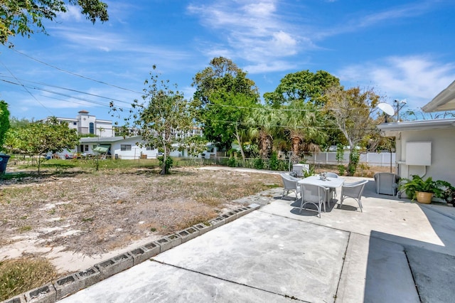 391 SW 2nd St, Boca Raton, FL 33432 - view of patio / terrace with outdoor dining space and a fenced backyard