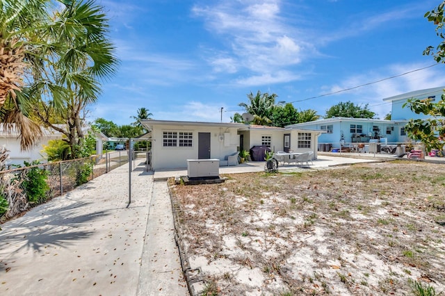 391 SW 2nd St, Boca Raton, FL 33432 - back of house with a patio area, stucco siding, and fence