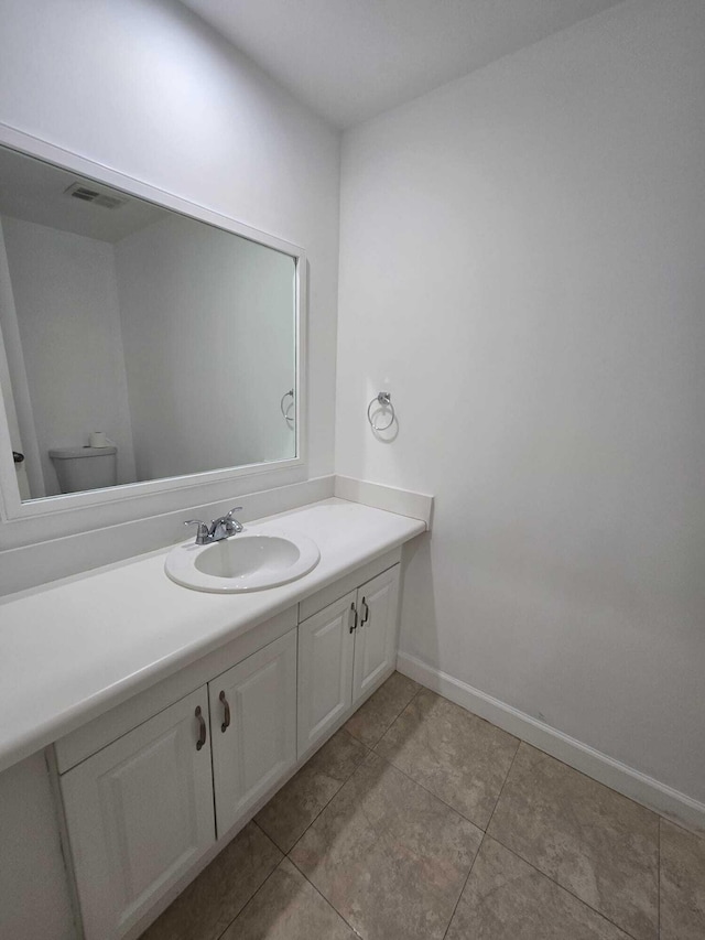 6363 Seven Springs Blvd Unit B, Greenacres, FL 33463 - bathroom featuring vanity, tile patterned floors, baseboards, and visible vents