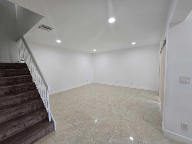 6363 Seven Springs Blvd Unit B, Greenacres, FL 33463 - basement with baseboards, stairs, visible vents, and recessed lighting
