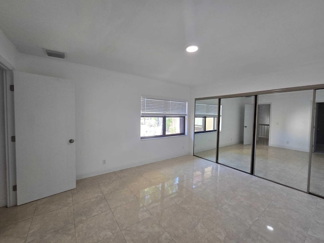 6363 Seven Springs Blvd Unit B, Greenacres, FL 33463 - unfurnished bedroom featuring recessed lighting, visible vents, and tile patterned flooring