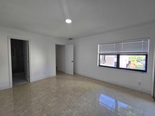 6363 Seven Springs Blvd Unit B, Greenacres, FL 33463 - unfurnished room with recessed lighting, visible vents, baseboards, and light tile patterned floors