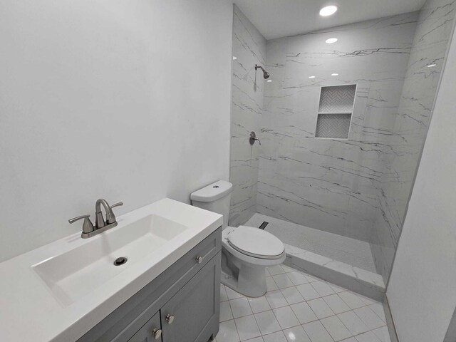 6363 Seven Springs Blvd Unit B, Greenacres, FL 33463 - bathroom with a marble finish shower, recessed lighting, vanity, and toilet