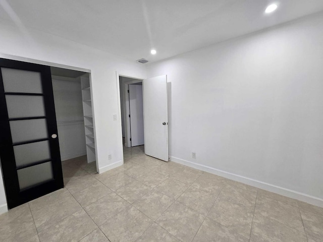 6363 Seven Springs Blvd Unit B, Greenacres, FL 33463 - unfurnished bedroom with baseboards, visible vents, recessed lighting, and light tile patterned flooring