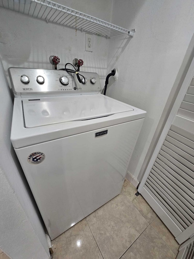6363 Seven Springs Blvd Unit B, Greenacres, FL 33463 - washroom featuring washer / clothes dryer, light tile patterned flooring, and laundry area