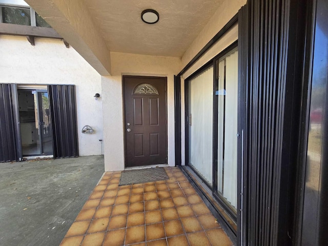 6363 Seven Springs Blvd Unit B, Greenacres, FL 33463 - doorway to property with stucco siding