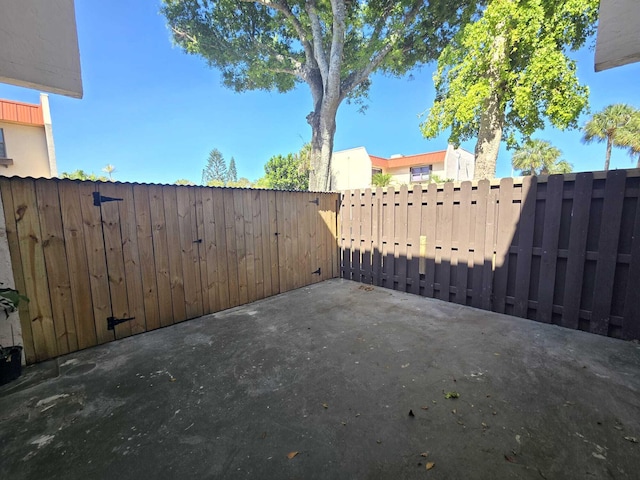 6363 Seven Springs Blvd Unit B, Greenacres, FL 33463 - view of patio with a gate and fence