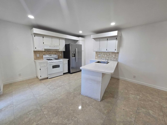 6363 Seven Springs Blvd Unit B, Greenacres, FL 33463 - kitchen featuring tile counters, a sink, white gas range oven, stainless steel refrigerator with ice dispenser, and under cabinet range hood