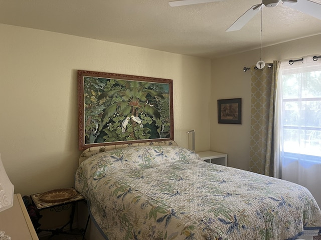 180 NE Lobster Rd, Port Saint Lucie, FL 34986 - bedroom featuring ceiling fan and multiple windows