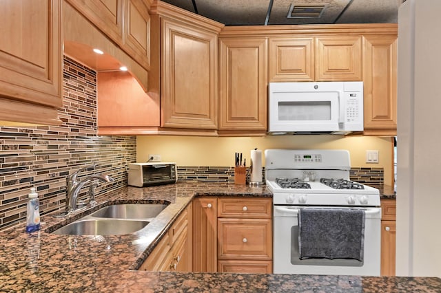 5725 Basil Dr, West Palm Beach, FL 33415 - kitchen with white appliances, a sink, and backsplash