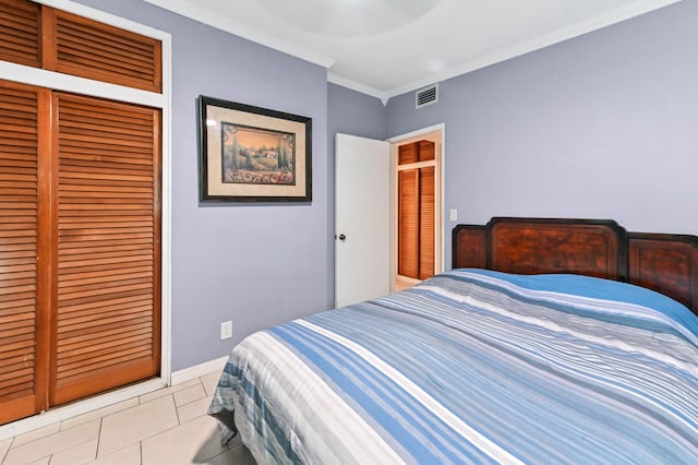 5725 Basil Dr, West Palm Beach, FL 33415 - bedroom with a closet, light tile patterned floors, and ornamental molding